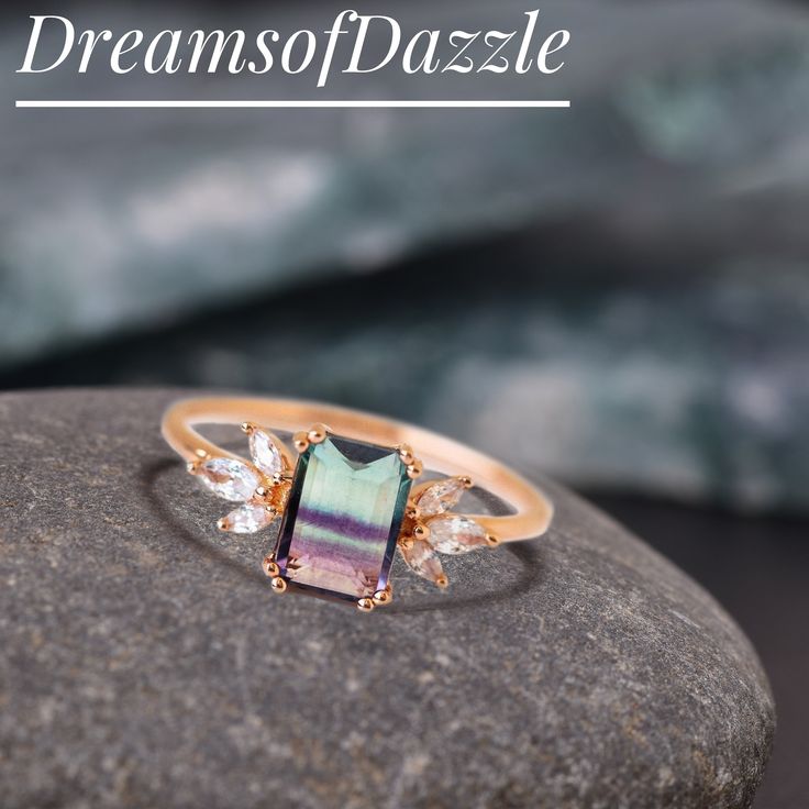 a close up of a ring on a rock with the words dreams of pazzle above it