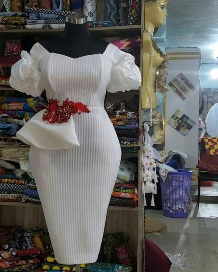 a white dress on display in a store