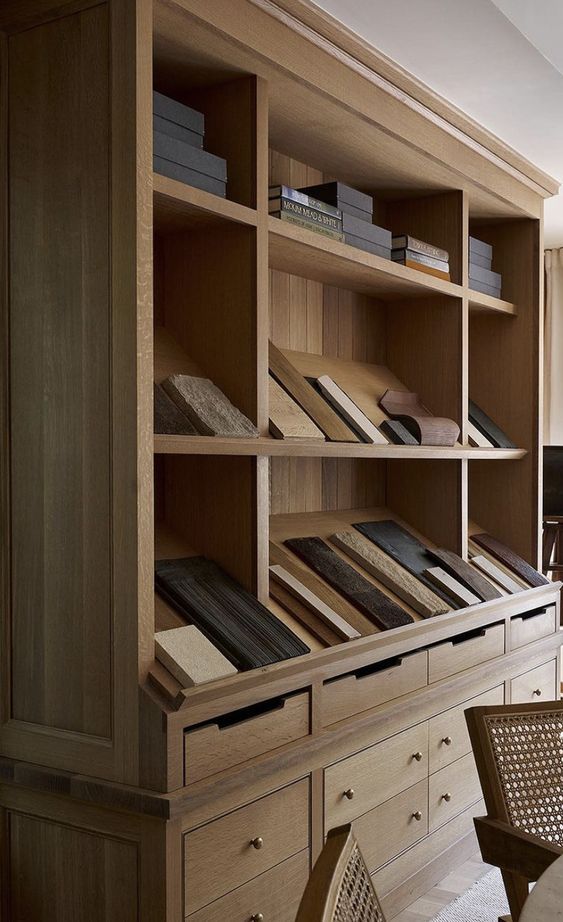 a wooden book shelf with many books on it