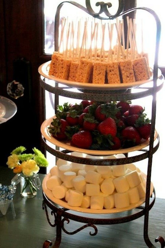 three tiered cake stand with strawberries and marshmallows