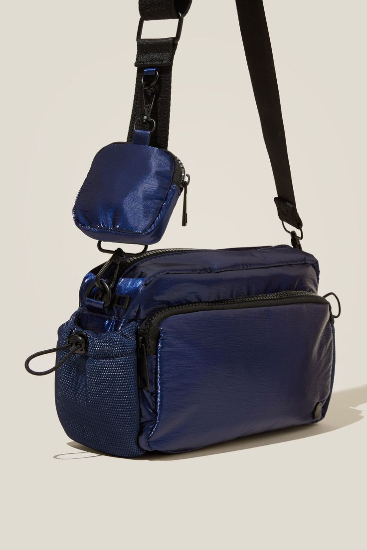 Active Essentials Crossbody BagBody - Active Essentials Crossbody Bag - Metallic Navy PeonyCotton On | Women | Activewear | AccessoriesCotton On | Women | Activewear | AccessoriesCotton On | Women | Activewear | Accessories Functional Navy Shoulder Bag With Pockets, Functional Blue Bags With Detachable Strap, Functional Navy Bag With Zipper Pocket, Versatile Navy Bag With Adjustable Strap, Navy Crossbody Shoulder Bag With Removable Pouch, Navy Crossbody Shoulder Bag For On-the-go, Navy Nylon Bags With Adjustable Strap, Navy Bag With Removable Pouch For On-the-go, Navy Crossbody Bag With Removable Pouch