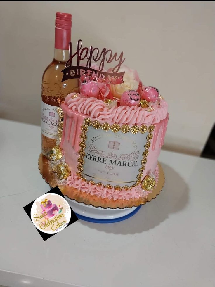 a birthday cake with a bottle of wine on top