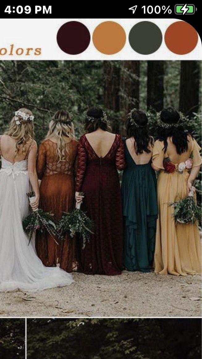 a group of women standing next to each other in front of trees