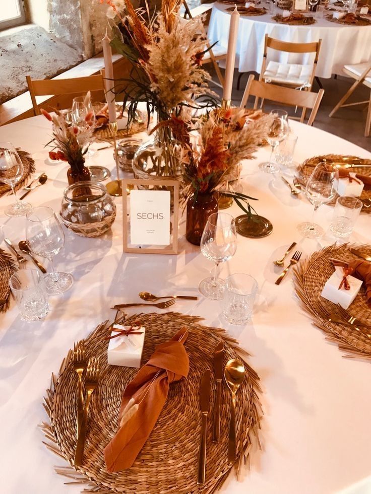 the table is set with place settings for dinner