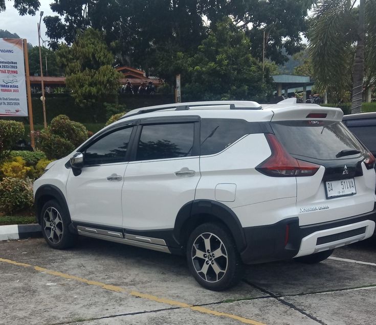 a white suv parked in a parking lot