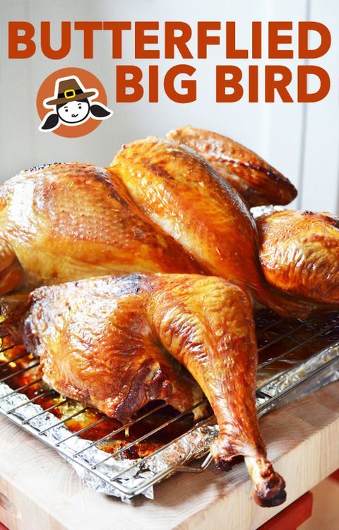 two whole chickens on a grill with the words butterflied big bird above it