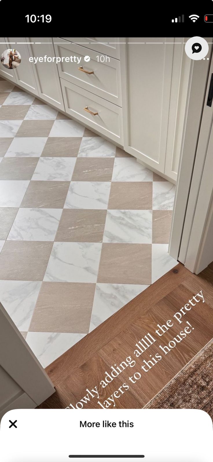 a kitchen with white cabinets and checkered flooring on the counter top is shown