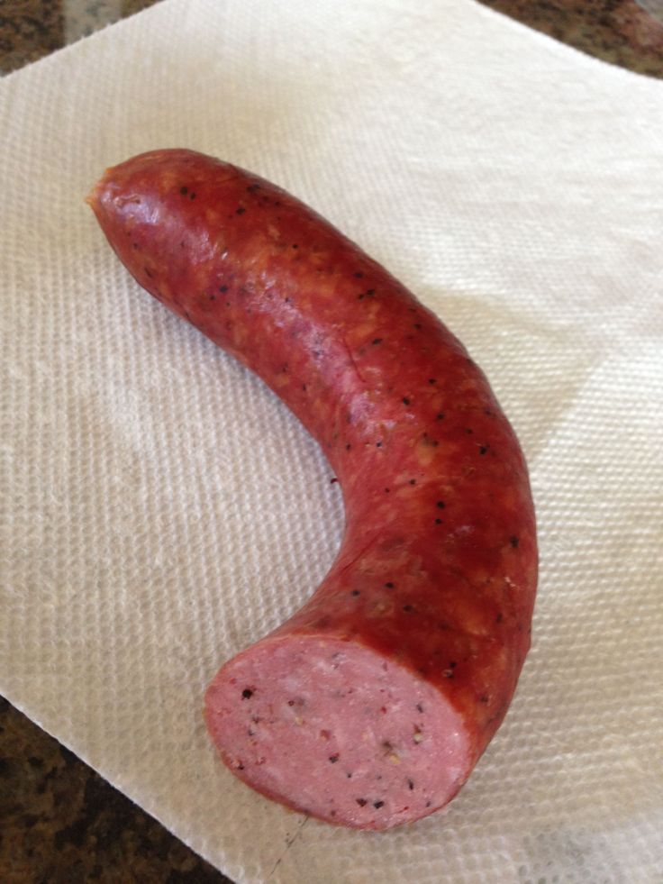 a sausage sitting on top of a piece of paper