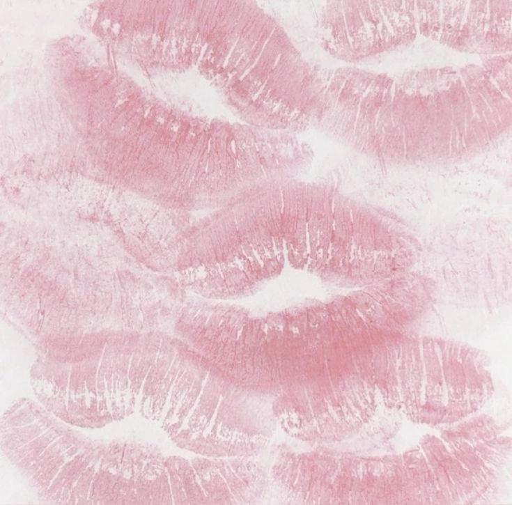 pink lips are arranged in the shape of a spiral on a white background with light streaks