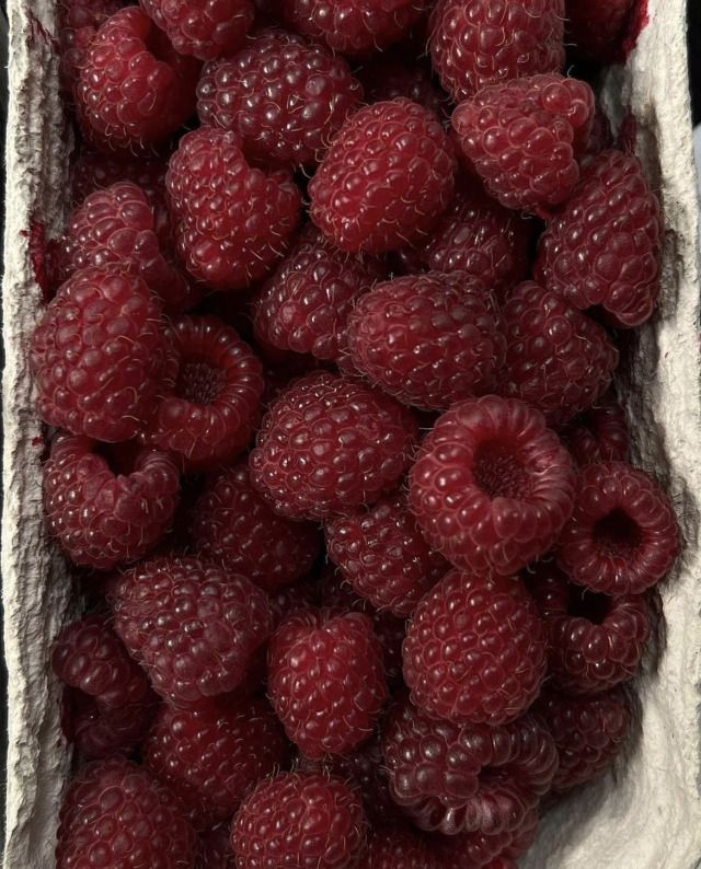 fresh raspberries in a paper bag ready to be eaten