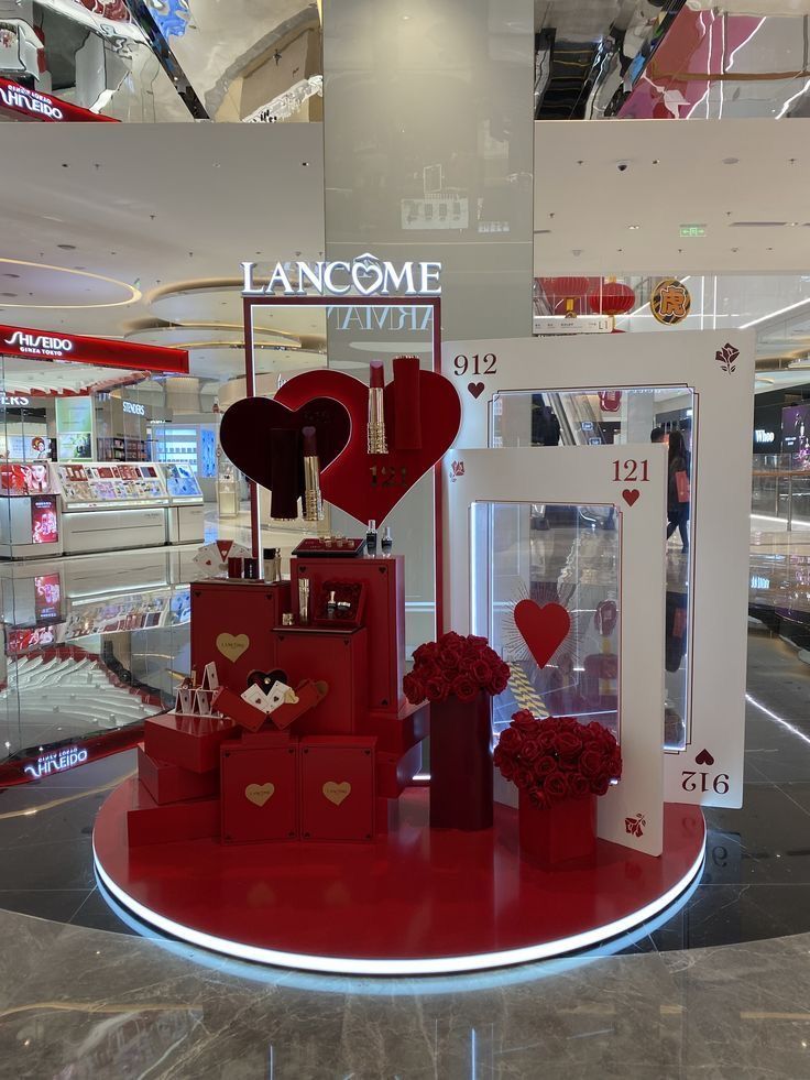 a display in a store filled with lots of valentine's day decorations and flowers