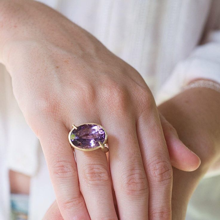 "14K solid gold double banded amethyst gemstone cocktail ring for woman.  A classical handmade double banded 14K solid gold ring, in a contemporary design set with a large beautiful natural clear purple amethyst gemstone.  Every jewelry collection needs a fine statement cocktail ring that will stand up and help you shine in any special occasion.  This ring, made from the finest materials is lightweight and comfortable to wear, perfect for parties, a day out on the town with your girlfriends and is a brilliant keepsake gift for your loved one.  Product Details: * One solid gold statement ring. * Set with gemstone. * Double banded. Materials: * 14K solid yellow gold. * Clear purple amethyst gemstone Measurements (approx): *Ring size in stock: 7 (us) ready to be shipped in 3-5 days. * Hight 1 Luxury Elegant Amethyst Ring For Formal Occasions, Luxury Purple Amethyst Ring For Gift, Luxury Faceted Amethyst Ring In Fine Jewelry Style, Luxury Handmade Gold Amethyst Ring, Jupiter Jewelry, Wide Wedding Rings, Solid Gold Bangle, Sculptural Ring, Amethyst Engagement Ring