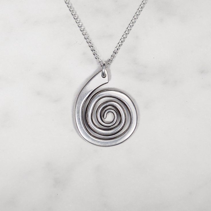 Smooth spiral pendant suspended from an 18" chain Pendant measures 3/4" x 1" Sterling silver or 14k gold fill chain Nickel-free Sterling Silver Swirl Necklace, Unique Spiral Sterling Silver Necklace, Modern Twist Swirl Jewelry As Gift, Modern Twist Swirl Jewelry For Gift, Minimalist Spiral Hand Forged Jewelry, Silver Spiral Metal Necklaces, Silver Spiral Metal Necklace, Unique Silver Spiral Necklace, Minimalist Spiral Silver Jewelry