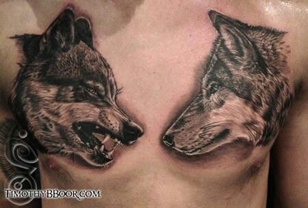 two wolf tattoos on the chest