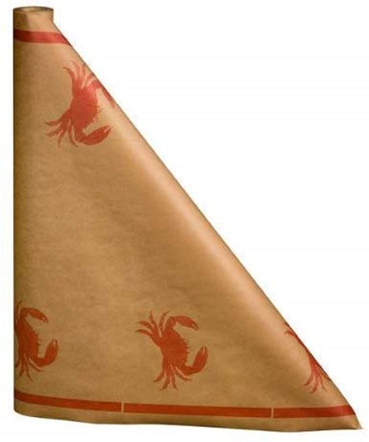 a triangle shaped piece of paper with red crabs on it and an orange stripe around the corner