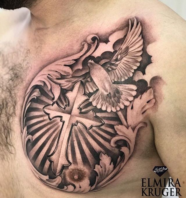 a man's chest with a cross and dove tattoo design on it, done by ellmira kruger