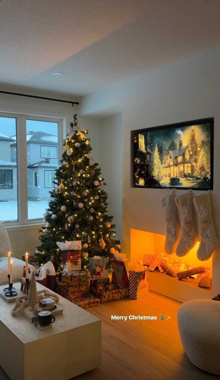 a living room filled with furniture and a christmas tree next to a fire place in front of a window