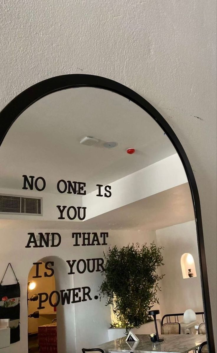 there is a mirror that says no one is you and that is your power on the wall