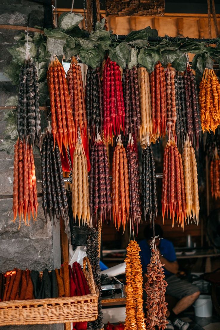 many different types of food hanging from hooks