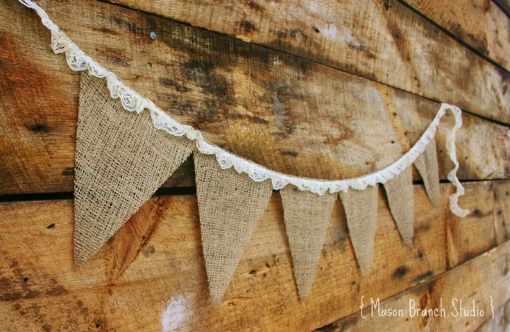 a close up of a wooden wall with bunting