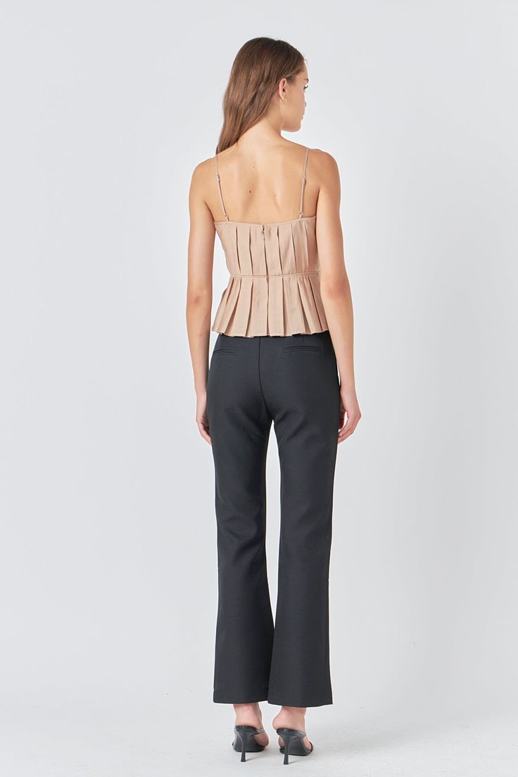 Elevate your everyday look with our stunning Pleated Peplum Top. The delicate peplum detail with pleated design adds a touch of femininity to this versatile piece. The adjustable spaghetti straps ensure a perfect fit while the lining offers maximum comfort. Whether you're dressing up for a night out or dressing down for a casual day this top is a must-have in your wardrobe. Don't miss out on this trendy essential! Peplum Pleated Adjustable spaghetti strap Lining Back zipper Hand wash cold Do not Formal Peplum Tops For Spring, Chic Fitted Peplum Top For Date Night, Fitted Elegant Peplum Top For Work, Elegant Fitted Peplum Top For Work, Chic Fitted Peplum Top, Elegant Peplum Top For Date Night, Chic Peplum Tops For Formal Occasions, Chic Formal Peplum Tops, Elegant Top With Ruffle Hem For Date Night