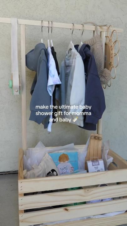 a wooden crate with clothes hanging on it