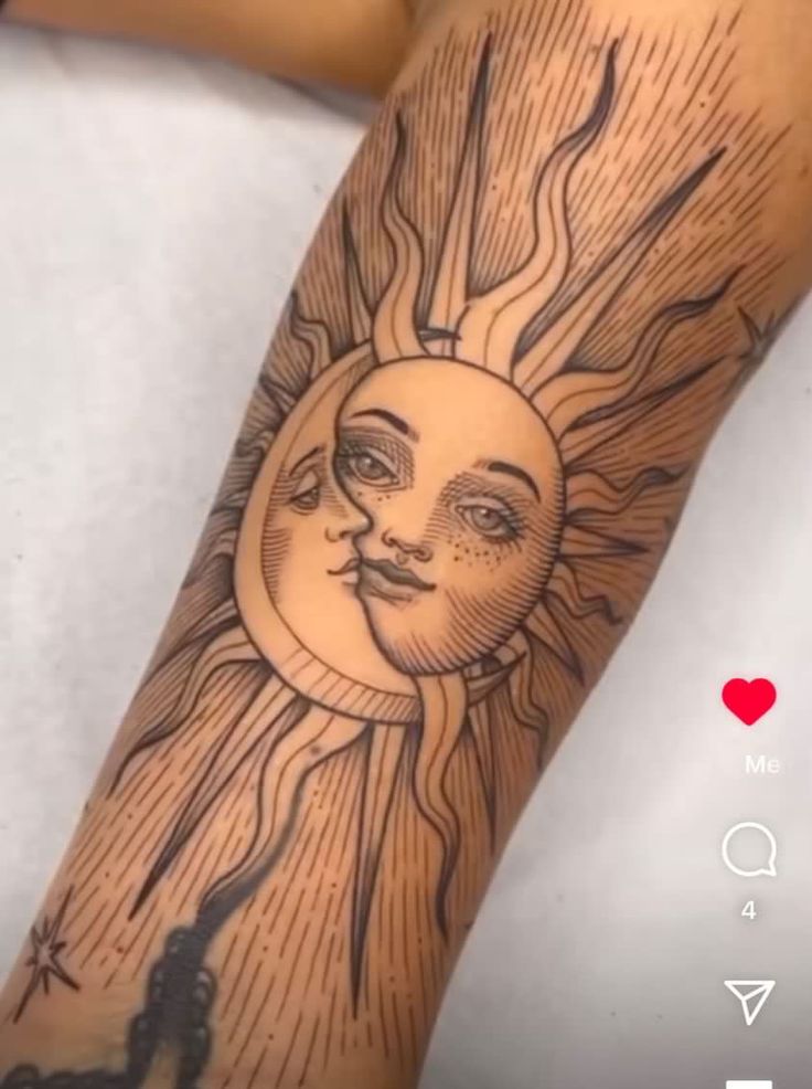 a sun and moon tattoo on the arm