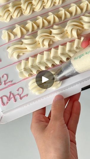 someone is decorating a birthday cake with icing