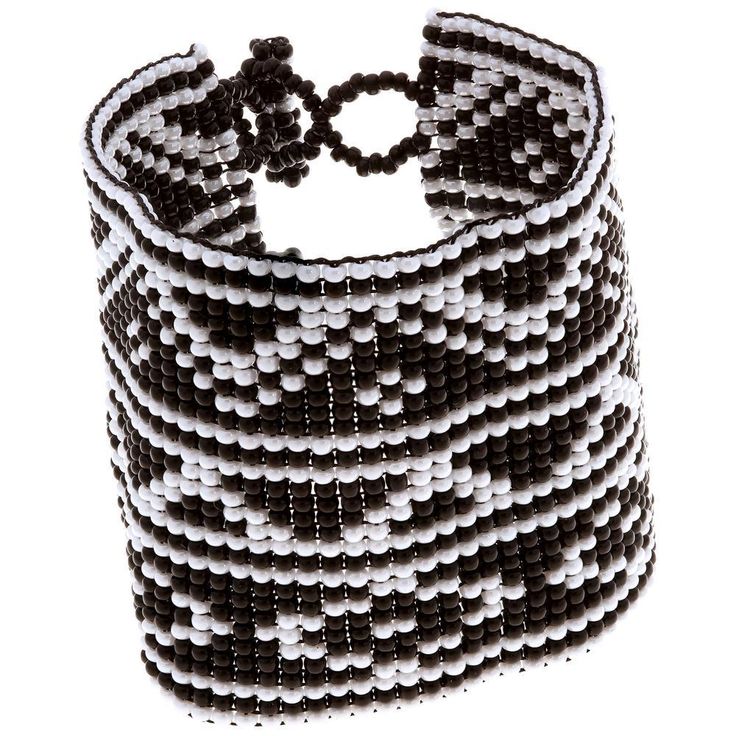 Black and white goes beautifully with everything, no matter where your wanderlust takes you. Trendy and tribal-inspired, this bracelet is perfect for pairing with summer whites or denim for a great boho look, and made by women bead artisans of La Casa in Guatemala. Since 2000, La Casa Cotzal has designed a range of Guatemalan handcrafted produced by artisan communities throughout the country. Artisans at La Casa are versed in both weaving techniques as well as in intricate bead work. The work pr Adjustable White Bohemian Cuff Bracelet, Southwestern White Beaded Bracelets With Colorful Beads, Bohemian Beaded Cuff Bracelet For Beach, White Beaded Round Beads Cuff Bracelet, Bohemian White Cuff Bracelet With Round Beads, White Beaded Cuff Bracelet With Round Beads, Adjustable Beaded White Cuff Bracelet, White Beaded Cuff Bracelet, White Beaded Bohemian Cuff Bracelet