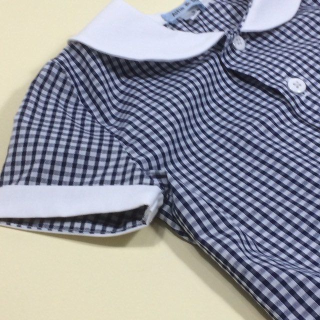 Retro styled classic gingham boys shirt. Gingham shirt with white button detail. Red, yellow, blue, black gingham. White cotton. White collar and buttons. Hand sewn finish. 6-12m Chest...29cm Nape to hem...33cm 12-18m Chest...31cm Nape to hem...35cm 18-24m Chest...32cm Nape to hem...37cm 2-3y... Chest...33cm Nape to hem...39cm 3-4y Chest...35cm Nape to hem...41cm Gift wrapped. From a smoke free and pet free home. Preppy Gingham Shirt For Summer, Cotton Gingham Top With Button Closure, Classic Gingham Cotton Top, Summer Preppy Gingham Shirt, Summer School Shirt With Buttons, Gingham Shirt With Buttons For Summer, Summer Gingham Shirt With Buttons, Preppy Gingham Collared Tops, Collared Gingham Top With Buttons