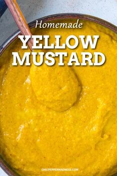 homemade yellow mustard in a pot with a wooden spoon and title overlay reads homemade yellow mustard