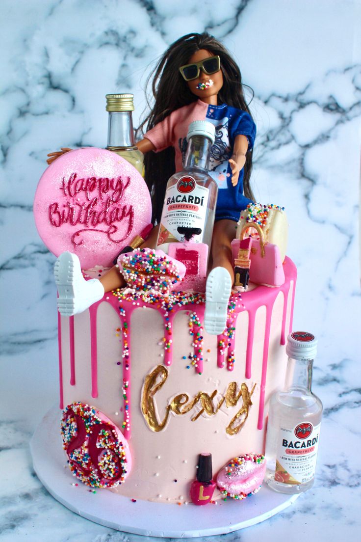 a birthday cake decorated with confetti, sprinkles and liquor