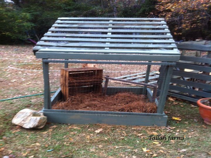 a chicken coop with hay in it