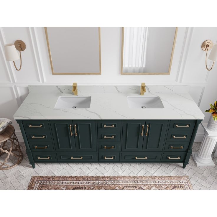 a bathroom with two sinks and mirrors on the wall next to a rug in front of it