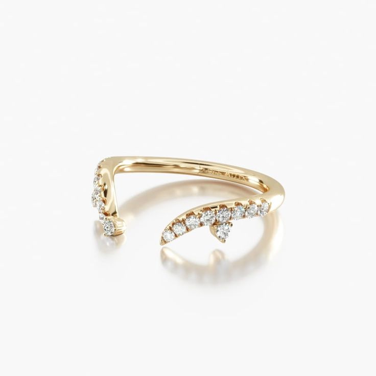 a yellow gold ring with diamonds on it