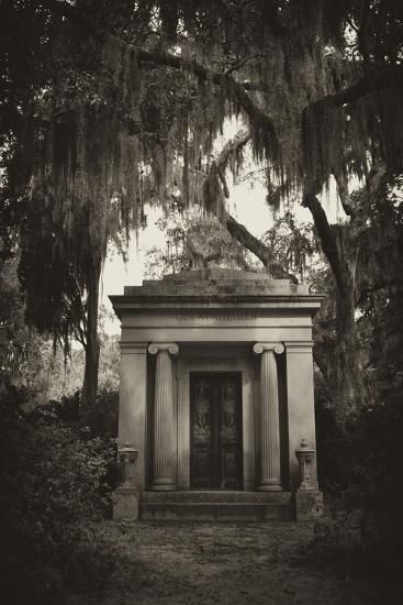 a black and white photo of an old cemetery