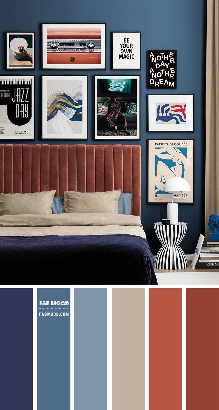 a bedroom with blue walls and pictures on the wall, including an orange headboard