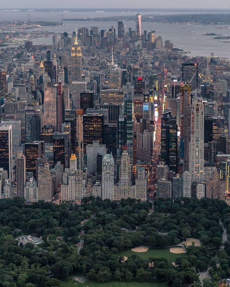 an aerial view of new york city at dusk