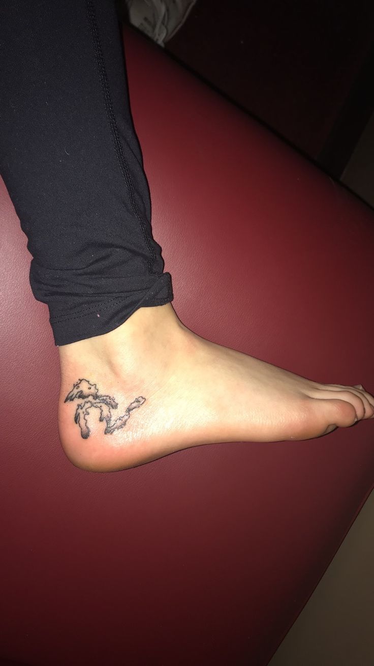 a person with a tattoo on their foot