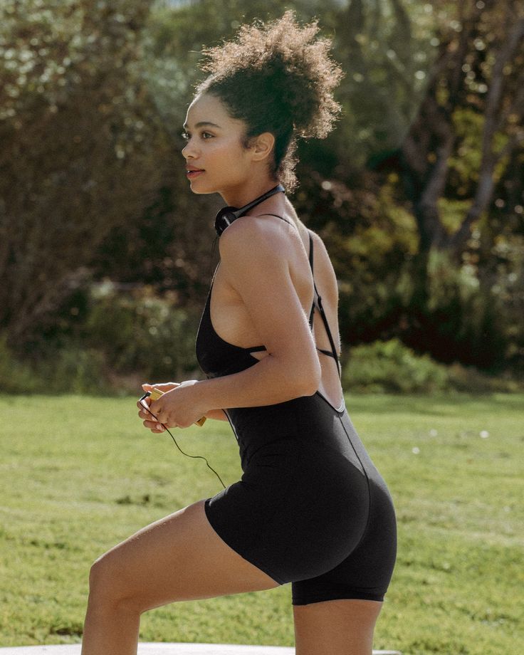 Owen Romper - Black Summer Athleisure Fitted Biker Shorts, Fitted Athleisure Biker Shorts For Summer, Fitted Strappy Back Bodysuit For Workout, Fitted Biker Shorts For Summer Workout, Fitted Summer Workout Biker Shorts, Summer Workout Athleisure Jumpsuits And Rompers, Sporty Cross Back Bodysuit For Workout, Sporty Workout Bodysuit With Adjustable Straps, Sporty Jumpsuits And Rompers For Spring Gym