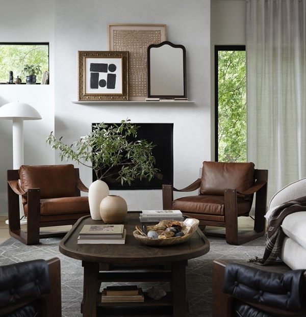 a living room filled with furniture and a fire place