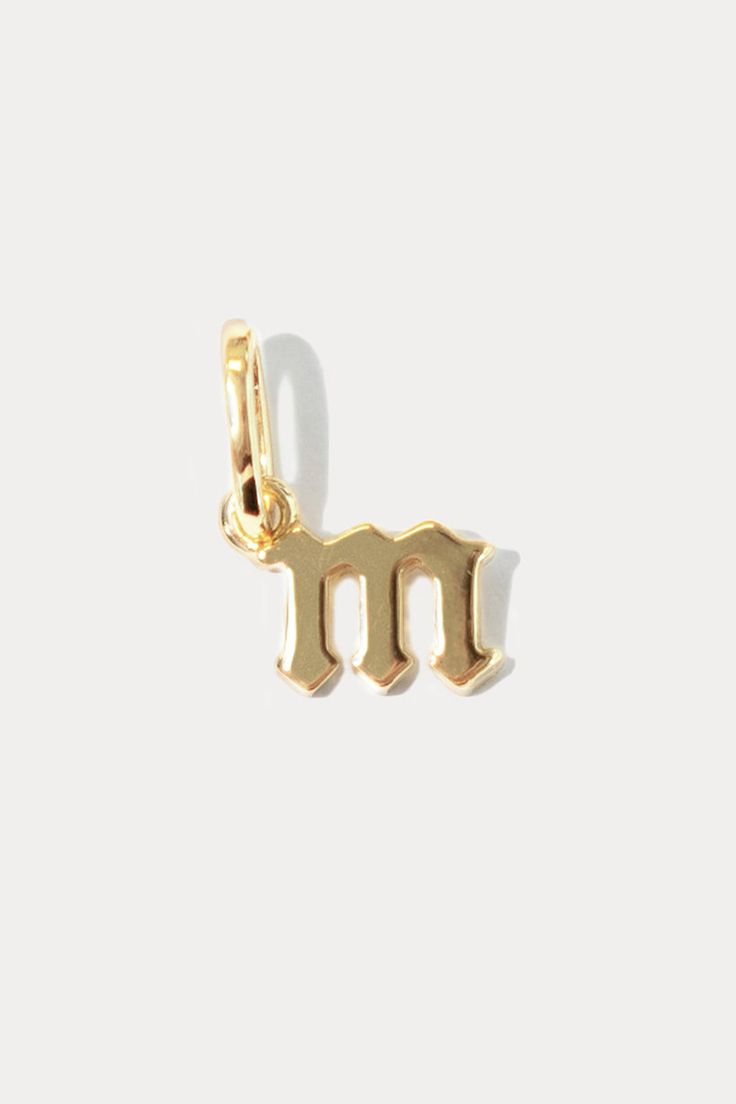 A reminder of a loved one is always close with the Petite Gothic Letter Charm. This charm adds a personalized look to your favorite layer. 18k gold-plated brass​ 9mm height, width varies by letter​ Letters Q, U, X and Y are not available Meaningful Gold Jewelry With Name, Meaningful Gold Everyday Jewelry, Personalized Gold Charms For Everyday, Personalized Yellow Gold Charms For Everyday, Gold Jewelry With Hallmark, 14k Gold Charms For Everyday Wear, Personalized Gold Charms For Gifts, Everyday Gold Charms, Tarnish Resistant, Personalized Yellow Gold-plated Charms