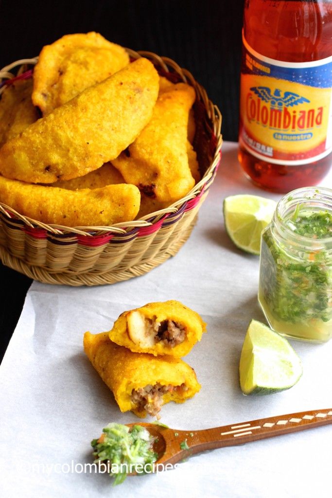 some food is sitting in a basket and on a table