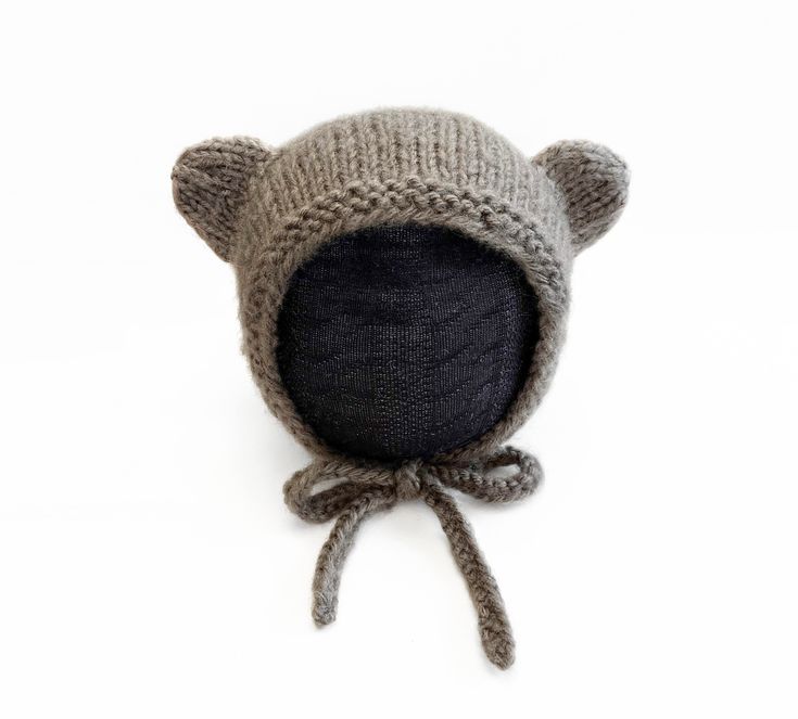 This finished knit baby bear bonnet is the perfect accessory for your little cub. Made from soft and warm yarn, the bonnet is not only cute but also practical for keeping your baby's head warm and cozy. The bonnet ties securely under the chin to ensure a snug and comfortable fit. Whether you're looking for a unique and handmade gift for a new parent or want to treat your own little one, this finished knit baby bear bonnet is a great choice. Size: 3-6 Months Dimensions: Depth: 5.75 inches Height: 6.25 Inches Tie length: 10 inches Made with 100% acrylic yarn Message me for another size! Adjustable Soft Knit Cozy Bonnet, Cozy Adjustable Soft Knit Bonnet, Baby Bonnet Pattern, Knit Bonnet, Baby Bar, Bonnet Pattern, Alpaca Yarn, Baby Head, Beautiful Hats