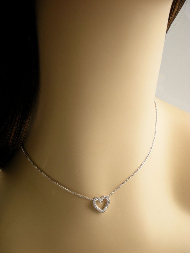 "This open heart pendent is 12.2 mm long and 12.3 mm wide it is set with 20 diamonds VS clarity and G color total weight .20cts. Heart is 18k and chain 14k total weight is approximately 3.3 grams. We love these pendent because it represents the way jewelry should be made with craftsmanship and quality. This pendent is anything but ordinary. Our pieces are designed and made with craftsmanship and sustainability in mind, our designs are made with handpicked fine quality gemstones and materials. Ea Elegant Heart Pendant With Box Chain, Elegant Heart Pendant Jewelry With Box Chain, Elegant Heart Pendant Necklace With Box Chain, Diamond Necklace With Box Chain For Gift, White Gold Heart Pendant Jewelry With Box Chain, White Gold Heart Necklace With 17 Jewels For Anniversary, Classic Open Heart Diamond Necklace For Gift, White Gold Box Chain Necklace For Anniversary, Anniversary White Gold Necklace With Box Chain