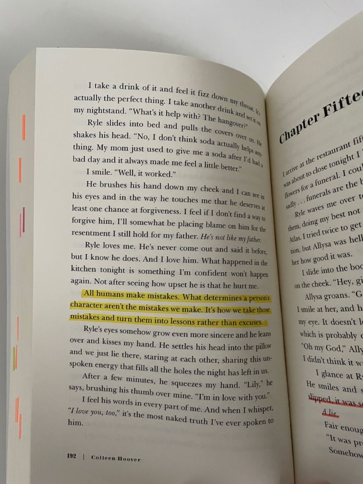 an open book with yellow lines on the page and in between it's pages