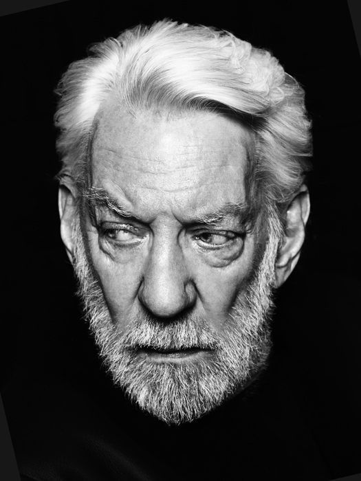 black and white photograph of an older man with greying hair looking at the camera