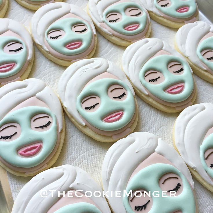 some cookies with faces on them and eyes painted to look like women's faces