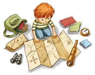 a boy sitting on top of a map surrounded by other items