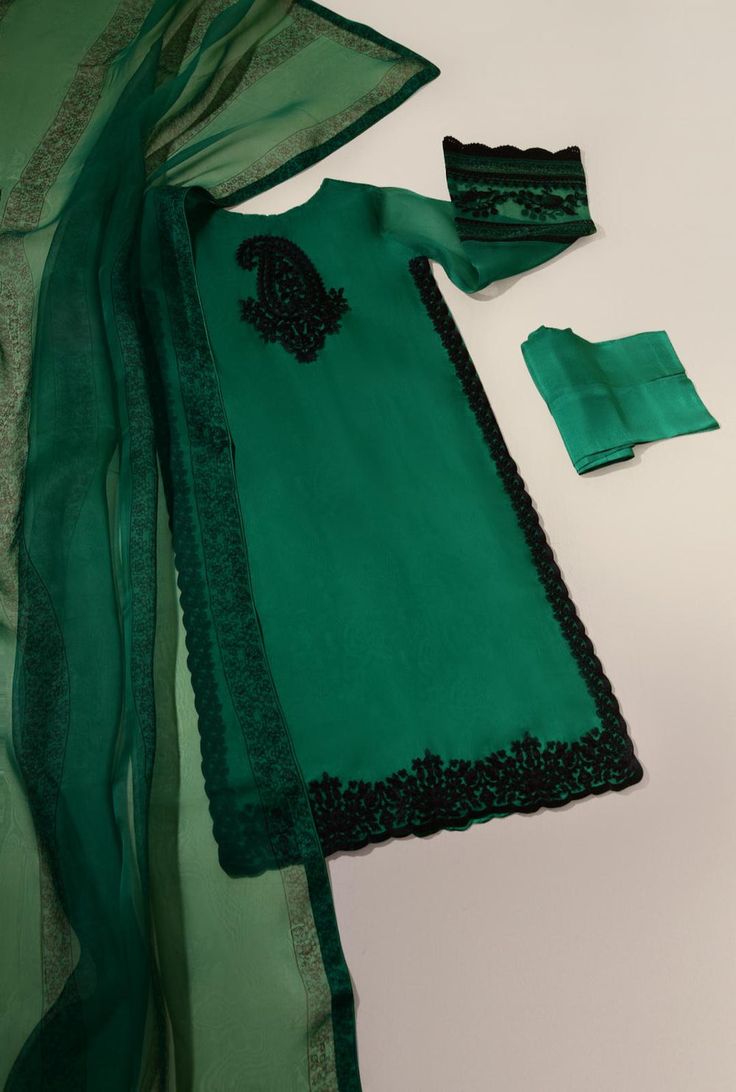 Curated on pure emerald green organza with hand kashmiri embroidery on front back and sleeves alongside hand blocked borders with pretty laces, matching pure raw silk trousers with hand blocked pure organza dupatta, “ Arnisha “ will be your new favourite look to go to. Order Duration: 4 to 6 weeks Designer Wear Green Sets With Resham Embroidery, Designer Green Sets With Resham Embroidery, Green Sets With Resham Embroidery For Designer Wear, Elegant Green Georgette Unstitched Suit, Green Organza Sharara With Dabka Work, Green Resham Embroidered Georgette Kurta, Festive Green Georgette Unstitched Suit, Green Dabka Lawn Suit For Party, Green Anarkali Unstitched Suit In Georgette